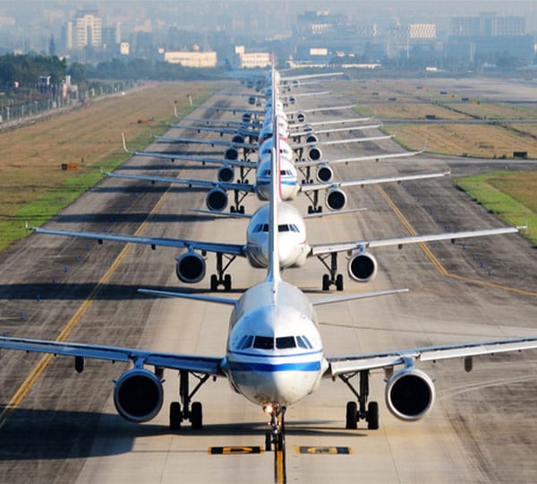 airplanes lined up on runway